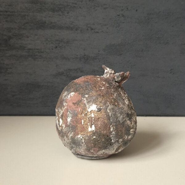 Decorative pomegranate with burgundy black spots
