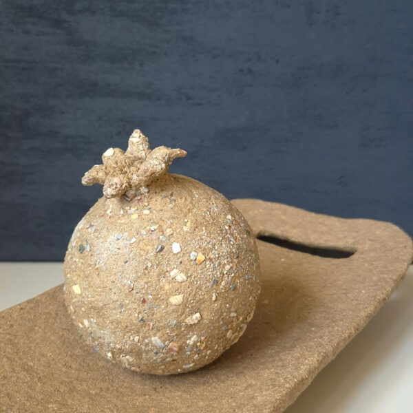 Decorative sand-coloured pomegranate made from recycled paper